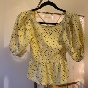 Yellow spotted top with puff sleeves and lace up back